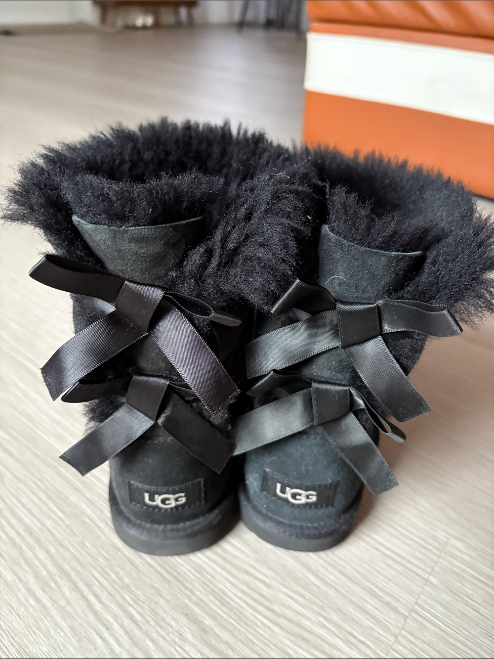 UGG Black Shearling Boots with Satin Back Bows
